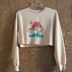 This is a cropped mushroom printed shirt! It has never been worn!